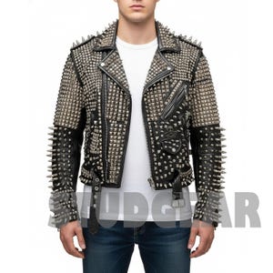 May include: Black leather jacket heavily studded with silver spikes and studs. The jacket features a classic biker style with a notched collar, asymmetrical zipper, and multiple pockets. The sleeves and shoulders are covered in spikes.