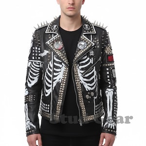 May include: Black leather jacket with white skeleton rib cage design, silver studs, and spiked shoulders. Features multiple patches and pins. A bold, edgy fashion statement.