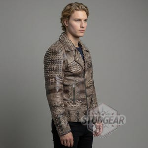 Close up of conical metal studs on python embossed leather shoulder