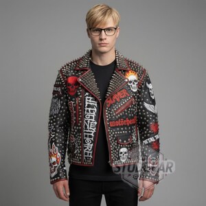 May include: Black leather jacket with silver studs and patches featuring skulls, flames, and band logos. The jacket has a red trim and a studded collar. The word "SLAYER" is embroidered on the front.