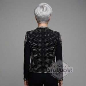 Edgy fashion blazer for women with heavy metal hardware on back and sleeves