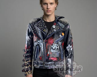 May include: Black leather jacket with silver spikes on the shoulders and collar. The jacket has red and white painted designs, patches, and buttons. The sleeves have leopard print cuffs. The word "HATED" is visible.