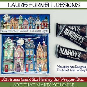 May include: A set of printable Christmas-themed wrappers for Hershey's snack-size chocolate bars. The wrappers feature a colorful illustration of a winter village with houses, snow, and a starry night sky. The text "Merry Christmas To All And To All A Good Night!" is printed on the top of the wrapper.