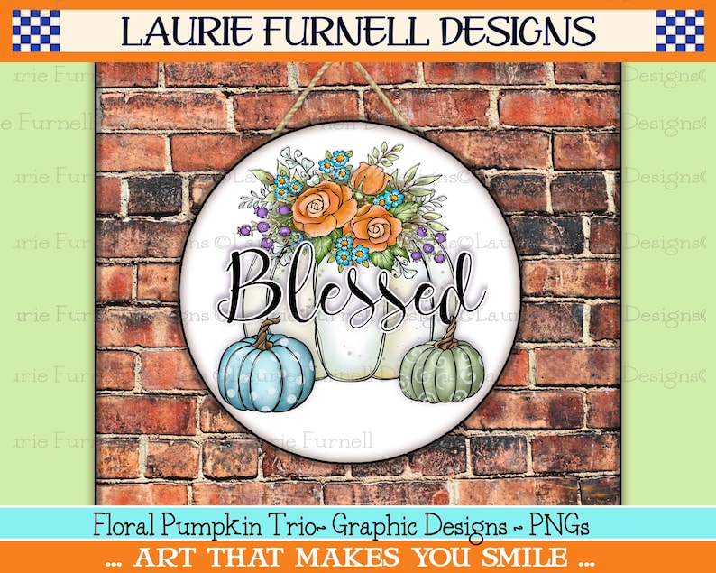 May include: A round, white sign with a floral arrangement of orange, blue, and purple flowers. The sign says "Blessed" in black script and features three pumpkins, one blue, one white, and one green. The sign is hanging on a brick wall.