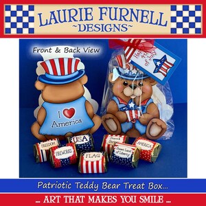 May include: Patriotic teddy bear treat box with red, white, and blue decorations. The box is filled with small wrapped candies with patriotic themes. The box says "Happy 4th of July" and "I love America".