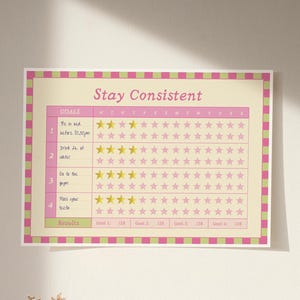 Puede incluir: Un rastreador de objetivos rosa y verde con las palabras "Stay Consistent" en la parte superior. El rastreador tiene cuatro objetivos: "Acostarse antes de las 10:30 pm", "Beber 2L de agua", "Ir al gimnasio" y "Cepillarse los dientes".