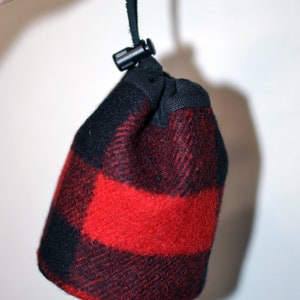 handmade drawstring bag made of Pendleton Wool Filson Blanket red and black plaid use as a golf tee bag golf balls valuable pouch great for any sport about 5 inches tall 3.5 inches wide circular bag leather drawstring golfer gift christmas