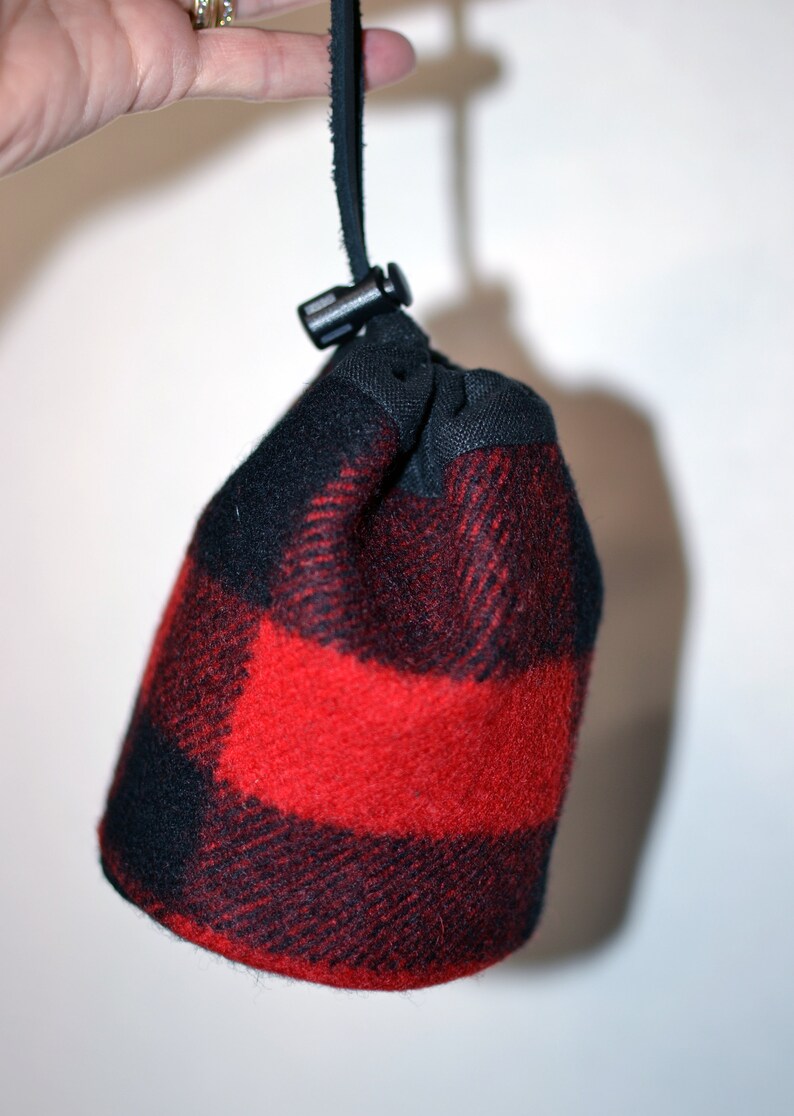 handmade drawstring bag made of Pendleton Wool Filson Blanket red and black plaid use as a golf tee bag golf balls valuable pouch great for any sport about 5 inches tall 3.5 inches wide circular bag leather drawstring golfer gift christmas