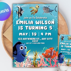 May include: A birthday party invitation featuring a blue background with sea creatures like Dory, Nemo, and a shark. The invitation reads "Emilia Wilson is turning 5" with the date, time, and RSVP information. A smaller matching card is also present.