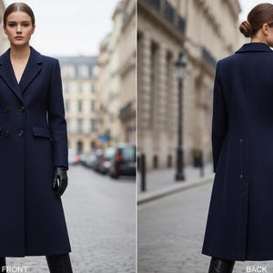 May include: A navy blue double-breasted coat with a tailored fit. The coat features a notched collar, two front pockets, and a long, flowing silhouette. The model is wearing black gloves and boots. The word "FRONT" is visible at the bottom of the image.
