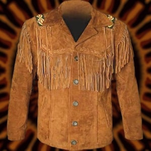 May include: A brown suede jacket with fringe detailing across the chest and sleeves. The jacket has a button-up front and decorative beading on the shoulders. The jacket is a classic western style.