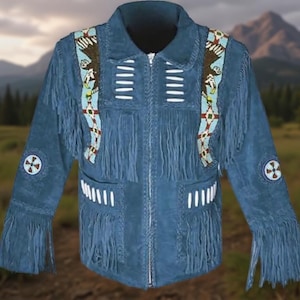 May include: A blue suede jacket with fringe and beaded accents. The jacket features a zipper closure, two front pockets, and decorative beadwork on the shoulders and sleeves. The sleeves and front pockets have fringe.