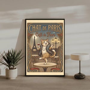 May include: A framed art print featuring a cartoon cat in Paris. The cat, wearing a fur stole and necklace, holds a wine glass. The print includes the text "Chat de Paris" and "Cafe de Flore" with a backdrop of the Eiffel Tower.