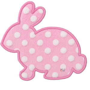 May include: Pink felt bunny applique with white polka dots and a pink embroidered outline. The bunny is in a side-facing pose, perfect for Easter or spring-themed crafts and decorations.
