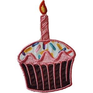 May include: Embroidered patch of a cupcake with a lit candle. The cupcake has a brown base, pink frosting, and colorful sprinkles. The candle is pink with a yellow and orange flame. This patch is suitable for clothing or accessories.