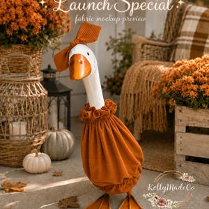 May include: A white goose figurine wearing a textured burnt orange fabric outfit consisting of a ruffled collar, a gathered body cover, and a matching bow on its head. The goose has a bright orange beak and orange webbed feet. Text reads Launch Special.