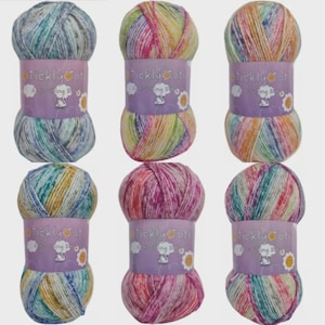May include: Six skeins of Tickly Tots yarn in various colors. Each skein is wrapped with a purple label featuring the brand name and a small illustration. The yarn colors include shades of blue, green, yellow, pink, and white.