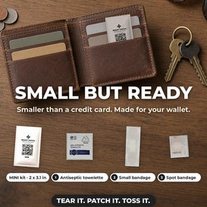 May include: A brown leather wallet containing a Ready Patch Mini kit, which includes an antiseptic towelette, a small bandage, and a spot bandage. The kit measures 2 x 3.1 inches. Text reads: SMALL BUT READY, TEAR IT. PATCH IT. TOSS IT.