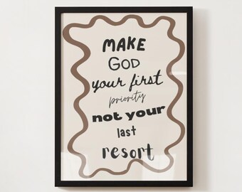 May include: A framed art print with a black border. The artwork features the text "MAKE GOD your first priority not your last resort" in a mix of fonts and sizes, within a wavy brown border on a beige background.