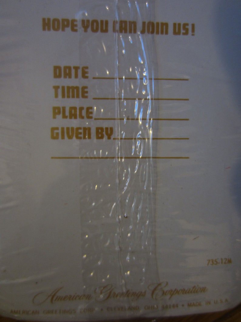 May include: A white card with gold lettering that reads "HOPE YOU CAN JOIN US!" with lines for writing in the date, time, place, and who gave the invitation. The bottom of the card reads "American Greetings Corporation" and "735-12M".