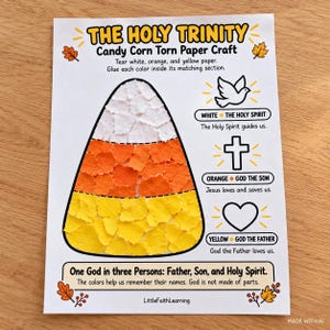 May include: A white paper craft sheet titled The Holy Trinity Candy Corn Torn Paper Craft. It features a large candy corn shape filled with torn white, orange, and yellow paper, alongside icons of a dove, a cross, and a heart with text labels.
