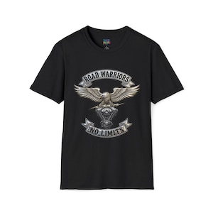 May include: Black t-shirt featuring a silver eagle emblem with outstretched wings, a motorcycle engine, and the words "ROAD WARRIORS" and "NO LIMITS" in a banner design. The shirt is a classic crew neck.