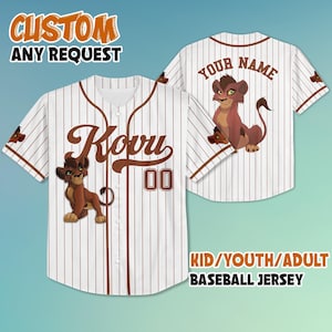 May include: White baseball jersey with brown pinstripes, featuring a cartoon lion cub graphic. The front displays the name "Kovu" and the number "00". The back has a lion cub graphic and space for a name. Text reads "CUSTOM ANY REQUEST" and "KID/YOUTH/ADULT BASEBALL JERSEY".