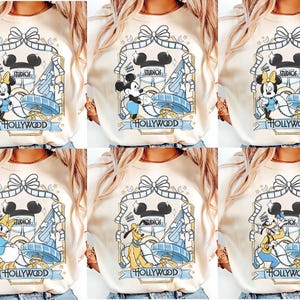 May include: A white ceramic mug with a black handle and the text "But First, Coffee" in a black, bold font. The mug is sitting on a wooden surface. The mug is approximately 4 inches tall.