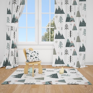 May include: A children's room with a mountain-themed design. The room features white curtains, a rug, and a pillow, all with a repeating pattern of mountains and trees in shades of green, gray, and pink. A small wooden chair and toys are also present.