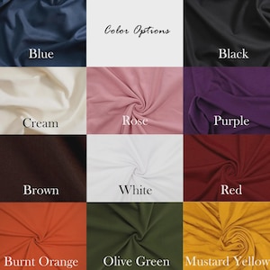 Op de afbeelding: Een kleurenkaart met stofstalen in verschillende kleuren. De stalen omvatten blauw, zwart, cr&egrave;me, roze, paars, bruin, wit, rood, verbrand oranje, olijfgroen en mosterdgeel. De tekst "Color Options" staat bovenaan.