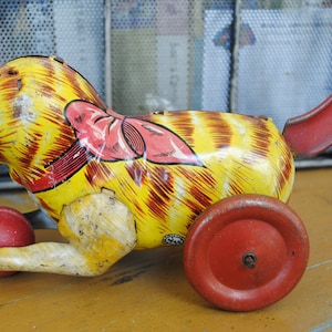 vintage kitty (40's to 50's ) metal push toy with wood wheels