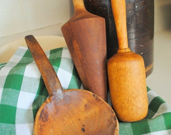 vintage, three wooden kitchen display utensils. masher scoop and pestle