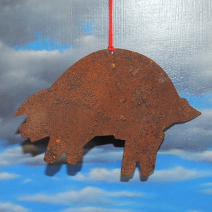 Christmas ornament of farm animal &quot;the pig&quot; cut from rusty metal for your country tree