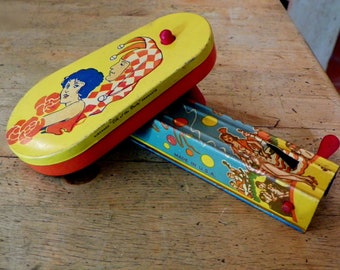 two vintage party noise makers made in USA