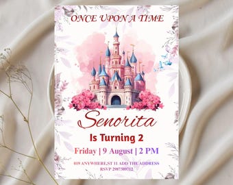 Könnte beinhalten: Einladungskarte mit einem rosa und blauen Schloss. Der Text "ONCE UPON A TIME" steht oben. Die Einladung lautet "Senorita Is Turning 2" mit Datum und Uhrzeit. Blumen und Schmetterlinge umgeben den Text.
