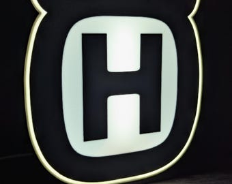 Letreiro luminoso de LED com o logotipo da Husqvarna