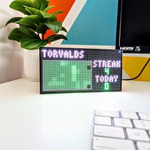 May include: A set of three ceramic mugs with a speckled, matte finish. The mugs are in shades of cream, light gray, and dark gray. Each mug has a simple, minimalist design, perfect for coffee or tea.