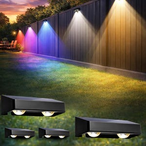 May include: A set of black LED outdoor lights. The image shows the lights illuminating a wooden fence with a range of colours, including red, purple, blue, and yellow. The lights are designed for outdoor use and are rectangular in shape.