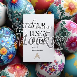 May include: A white card mockup with the text "Card or Invitation, Your Design Here" is surrounded by colorful Easter eggs. The eggs are decorated with floral patterns in shades of blue, pink, yellow, and white. The mockup is created by TrueNorthMockups.