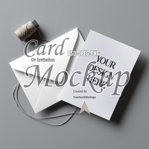May include: A mockup featuring a white card and envelope with the text "Card Or Invitation Mockup" and "Your Design Here". A spool of twine is next to the card and envelope on a gray surface.