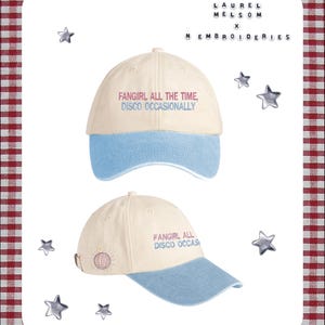 May include: Two baseball caps with the text "FANGIRL ALL THE TIME, DISCO OCCASIONALLY". The caps have a cream-coloured crown and a light blue brim. The caps are surrounded by star-shaped embellishments and the text "LAUREL MELSOM x N EMBROIDERIES".