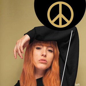 May include: Black sweatshirt with a small peace symbol on the left chest. The image features the text "MY PEACE IS MY PRIORITY" in gold lettering on a black circle. The background is a solid, muted gold color.
