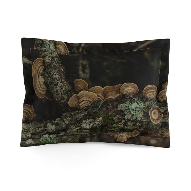 May include: Pillowcase with a print of a tree branch covered in brown, shelf-like fungi. The fungi have concentric rings and are set against a dark, blurred background. The branch also has patches of green moss.