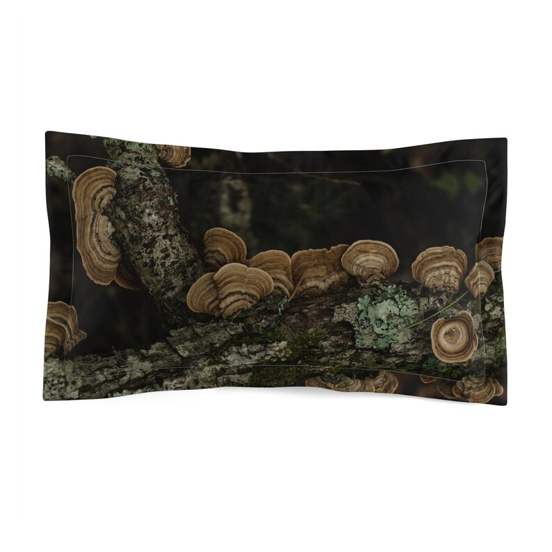 May include: Rectangular pillowcase with a print of a tree branch covered in brown and tan bracket fungi. The fungi are clustered on the branch, set against a dark background. The pillowcase is rectangular.