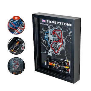May include: Black framed 3D artwork featuring the Silverstone race track map with a red track outline. Includes a miniature race car model and the text "SILVERSTONE". Additional inset images show the track and car.