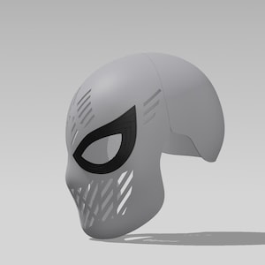 May include: A light gray full-head mask featuring a smooth, rounded dome shape. The mask includes large, almond-shaped eye openings outlined in black with a fine mesh screen, and decorative diagonal slit patterns across the forehead and chin area.