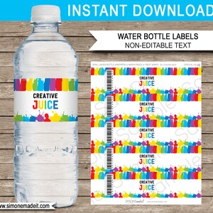 May include: A clear water bottle with a label that reads "CREATIVE JUICE" in colorful letters. The label has a design of paint strokes and splatters in various colors. The image also shows a sheet of matching labels.