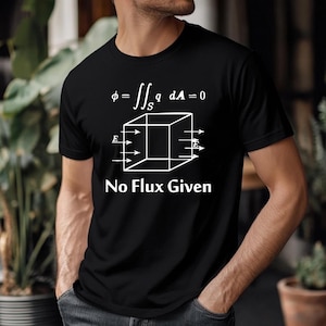 May include: Black t-shirt featuring a white graphic of a cube with arrows and mathematical equations. The text "No Flux Given" is printed below the graphic. The shirt is made of a soft material.