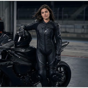 May include: A black motorcycle and a black leather racing suit with a helmet and gloves. The motorcycle has the Yamaha logo. The racing suit has reinforced padding on the shoulders and knees.