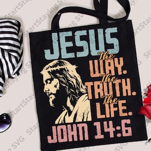 May include: Black tote bag with the text "JESUS" in blue and "The WAY. The TRUTH. The LIFE. JOHN 14:6" in orange and pink. A side profile illustration of Jesus is featured on the bag.